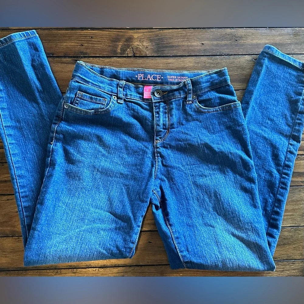 The Children’s Place girls jeans size 12. medium wash and dark wash 2 pairs!